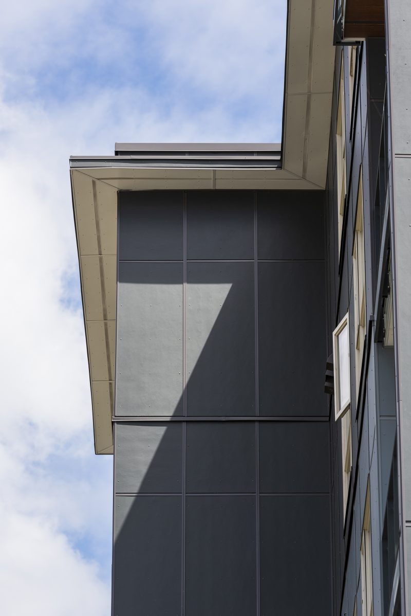 Dark siding wall of the Residences at Fremont Village in Port Coquitlam.