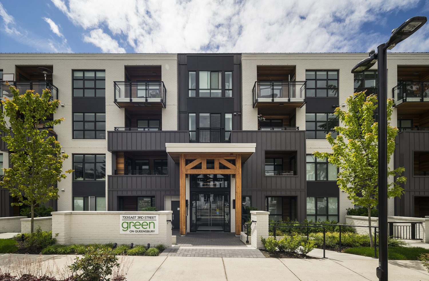 Front entrance view of the Green condo building in Vancouver